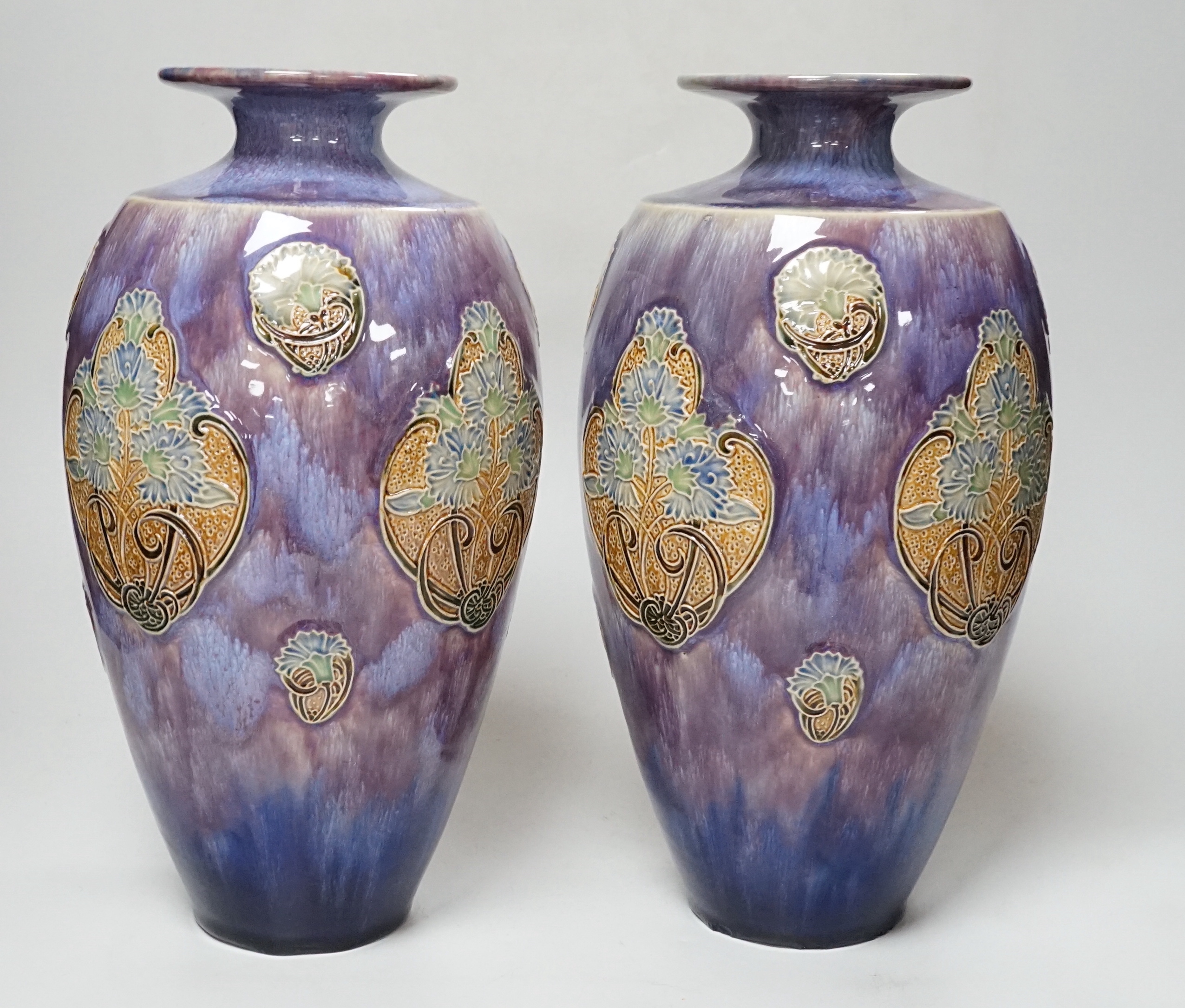 A pair of Doulton stoneware vases by Florie Jones, 31cm